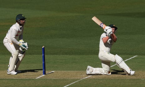 David Warner slog sweeps for six in the first Test.