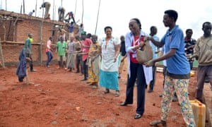 Marguerite Barankitse takes part in constructing a workshop at Mahama camp