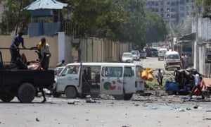 Somali security forces evacuate the injured from the scene of an explosion after a suicide bomber blew up his explosives-laden vehicle near the education ministry headquarters in Somali capital Mogadishu on April 14, 2015.