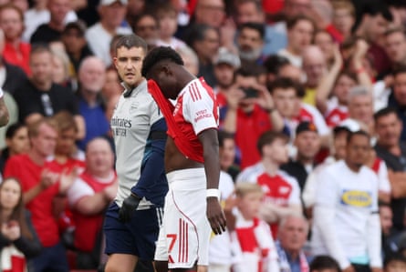 Bukayo Saka looks dejected after sustaining what looked like a hamstring injury