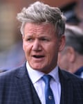 Gordon Ramsay in a suit at a football match
