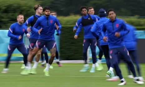 England players warm up during a team training session at Tottenham’s training ground on Monday.