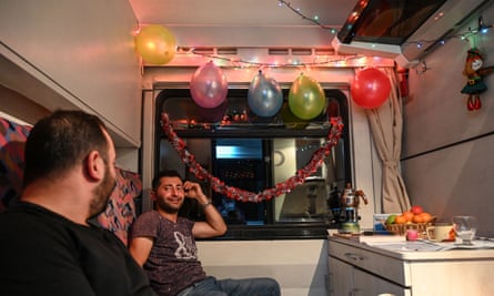 Passengers hang fairy lights and balloons in their sleeper cabin on the Doğu Express.