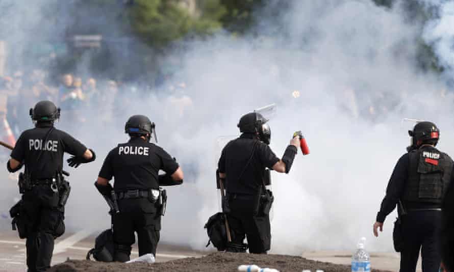 Denver police officers during a protest outside the state capitol in Colorado on 30 May 2020.
