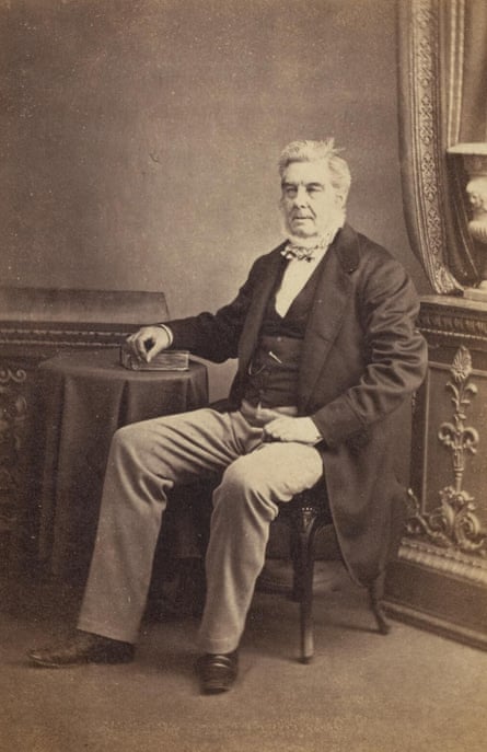 Black and white image of man sitting in a chair