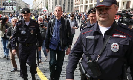 Tatchell being led away by Russian authorities in Moscow after his one-man protest at the World Cup, 2018.