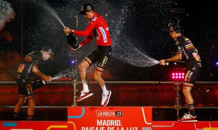 Sepp Kuss celebrates on the podium after his victory was confirmed in Madrid