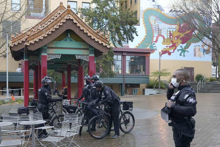 Seattle police officers begin their patrols in Seattle’s Chinatown-International district.