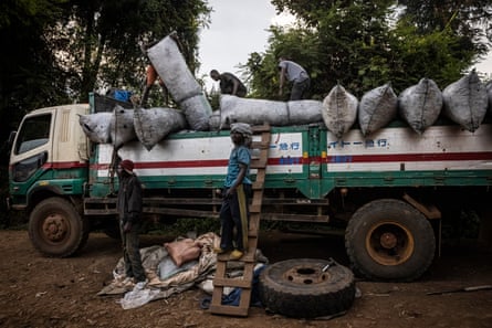 A truck loaded with bags of charcoal