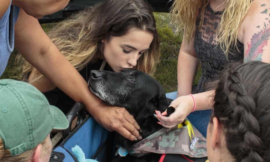 Paige Alfred gives a kiss to Cena before they leave for his last ride in downtown Muskegon, Michigan.