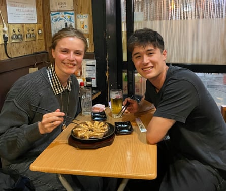 Pinner pictured with his girlfriend Louisa in Tokyo.