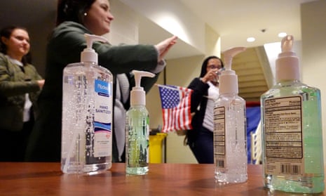 Hand sanitizer is offered to attendees of a Joe Biden rally on Monday in Detroit, Michigan. 