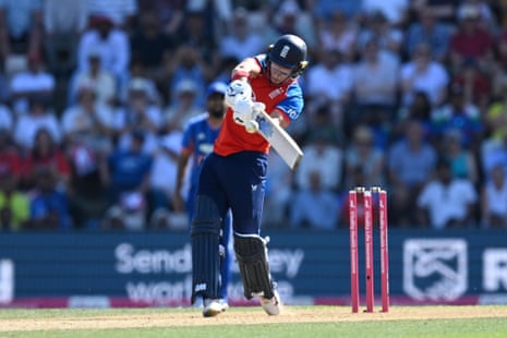 Jacob Bethell of England plays an attacking shot and is caught by Tilak Varma
