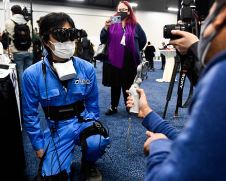 An CES attendee tries out the HaritoraX full-body tracking system for an immersive VR experience.