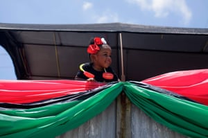 A girl looks out from a parade float during a Juneteenth parade in Galveston, Texas, on June 19, 2021