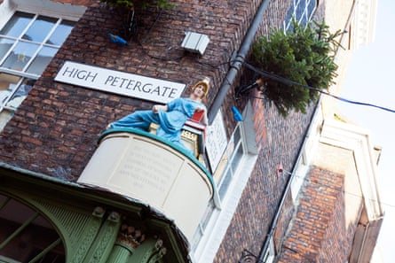 High Petergate York City road street sign Centre UK England statue figure of Minerva goddess of wisdom and drama