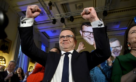 Petteri Orpo, the leader of National Conservative party, celebrates with family and colleagues after came first in the Finnish elections
