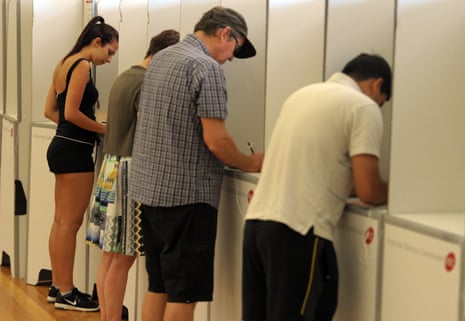Voters fill out their ballots in the 2014 Victorian state election