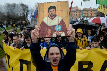 Demonstrators with an icon-stylised painting of Durov protest against the blocking of Telegram in Russia during a May Day rally in Saint Petersburg in 2018.