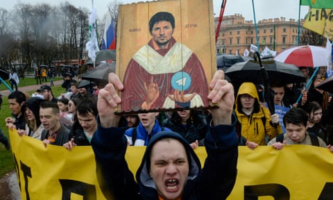 Protester holds a icon depicting Pavel Durov during a demonstration in St Petersburg against the blocking of Telegram in Russia in 2018. eiqrriukiqhkinv