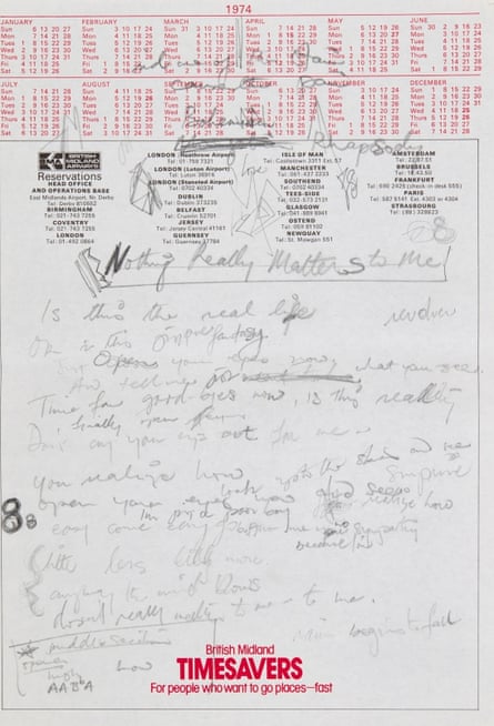 A page of black scribbled writing on top of the red print of a calendar.