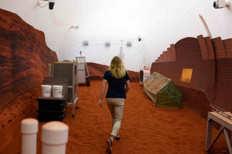 Dr Suzanne Bell walks through a simulated Mars exterior portion Mars Dune Alpha, a 3D printed habitat at the Johnson Space Center, in Houston, Texas.