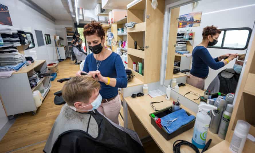 Silke Wolf and other barber angels cut hair for residents and volunteers for free