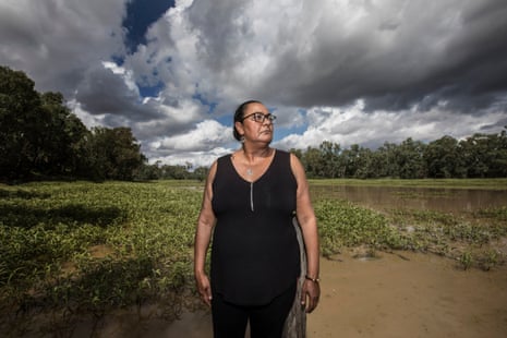 Judy Duncan stand by the muddy Mehi river that runs through Moree