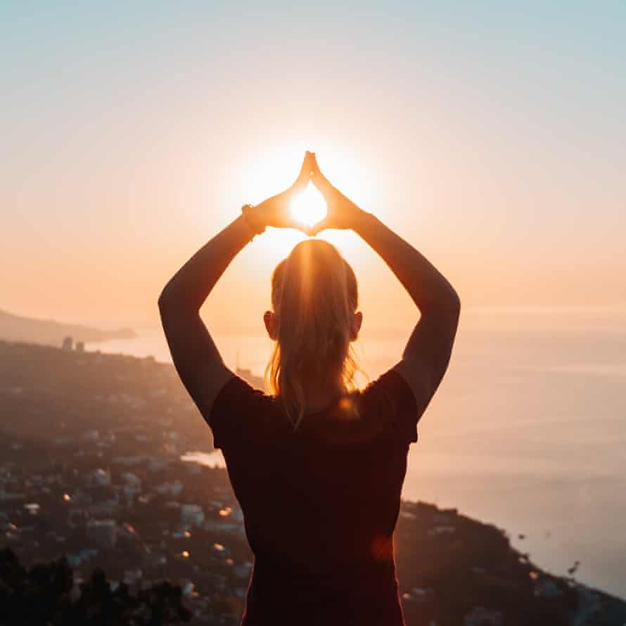 Woman practising yoga outside