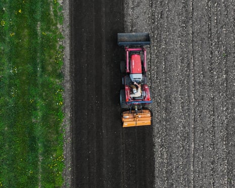 aerial view of a tractor turning soil