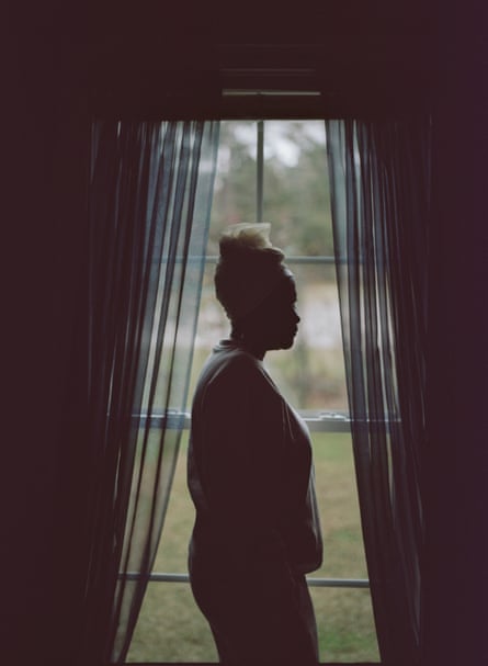 a woman’s silhouette by a window