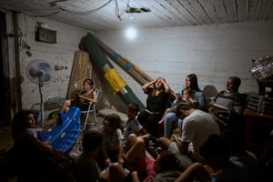 Israelis take shelter during air raid sirens warning of incoming strikes by Iran, in Bnei Brak