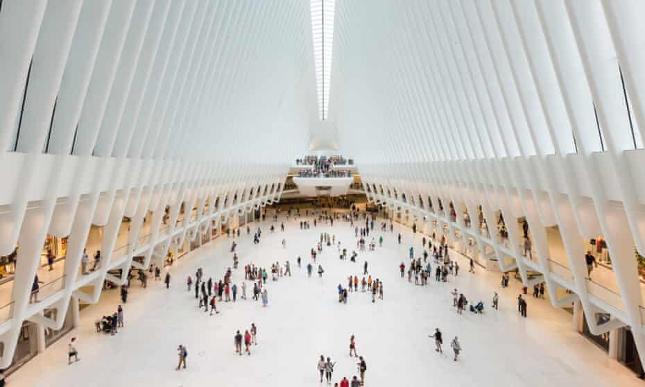 Shoppers and tourists enjoy the view inside the Oculus and new stores in the Westfield World Trade Center mall in New York City.