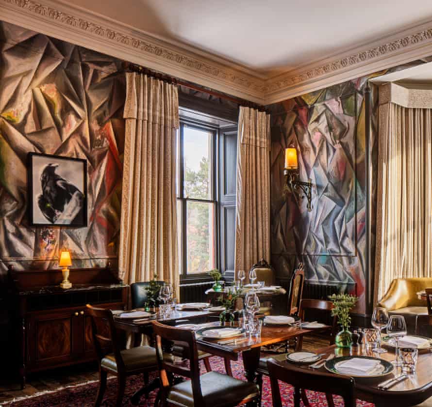 Striking views: the dining room with Guillermo Kuitca muralled walls and a Gerhard Richter eagle.