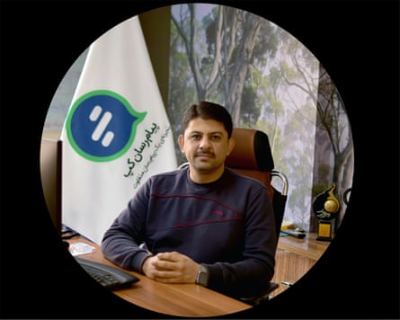 Mahdi Anjidani in image taken from his LinkedIn profile; he wears a black top and sits at a desk in a high metal and leather chair. The wallpaper behind him has a pattern of trees and there is a flag with a Gap Messenger logo. He has neat, thick side-parted black hair and small moustache.