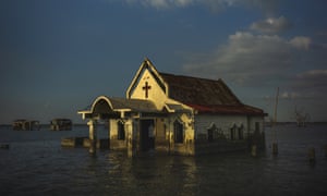 Sea water engulfs the church of Pariahan village, north of Manila, Philippines, in November 2018.
