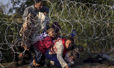 Syrian migrants enter Hungary at the border with Serbia in 2015. 