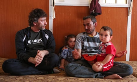 Gaiman meets Ayman and his family at Za’atari refugee camp.