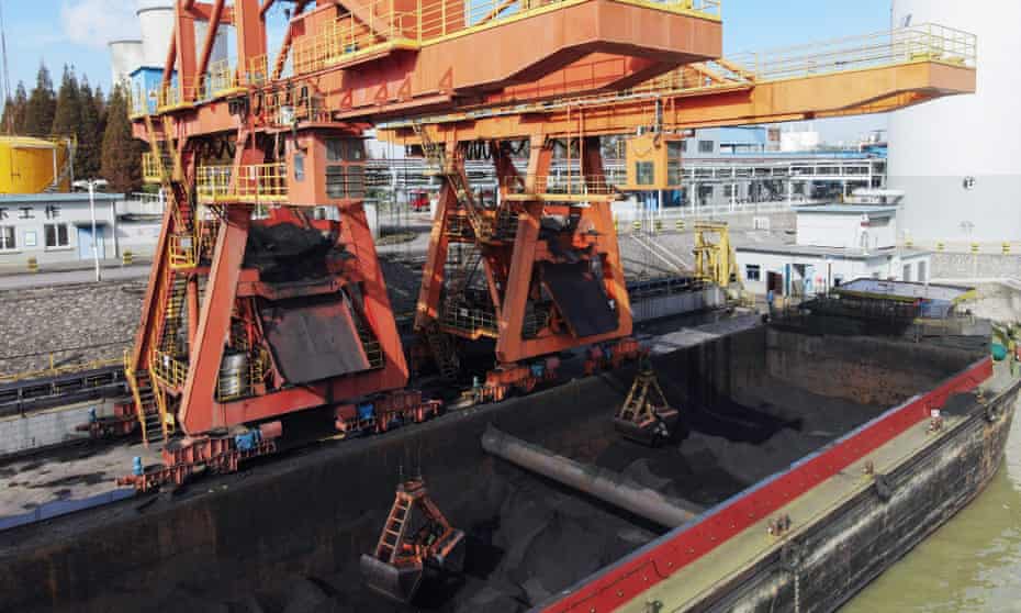 Coal is unloaded from a barge
