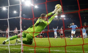 Sheffield United’s Dean Henderson dives to his right to save a first-half penalty.