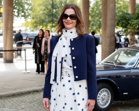 Lady Starmer wearing a cream pussy-bow blouse with a navy polka dot print and matching wide-leg trousers