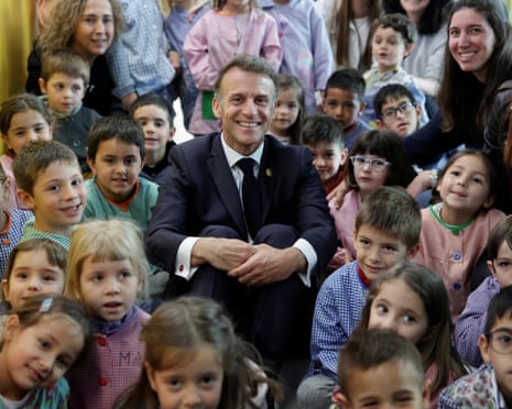 France's President and Co-Prince of Andorra Emmanuel Macron (C) poses with students and teachers at a school in Santa Coloma, on the second day of his visit to the microstate of Andorra.