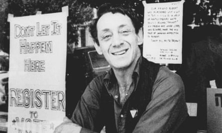 In this November 1977, file photo, Harvey Milk poses in front of his camera shop in San Francisco