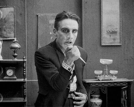 A black-and-white photo from a film showing a man brandishing a knife