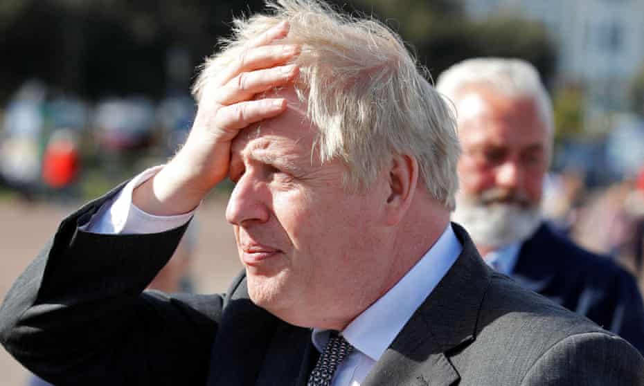 Britain’s Prime Minister Boris Johnson gestures as he campaigns in Llandudno, north Wales on April 26, 2021, ahead of the May 6 Welsh elections.