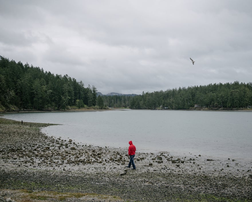 Lummi Tribal Chairman Jeremiah Julius walks the beach on English Camp on the Puget Sound following a ceremonial feeding of the qwe ‘lhol mechen, commonly known as orcas, Wednesday, April 10, 2019 in Washington.