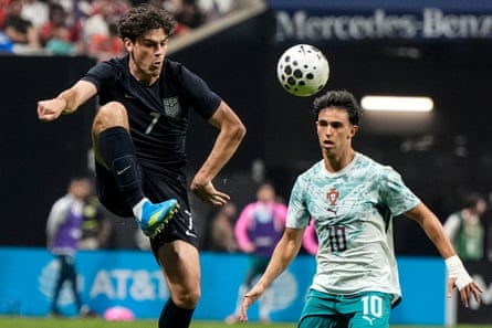 Gio Reyna (7) hits the ball against Portugal’s Joao Felix (10) during the second half of an international friendly soccer match, Tuesday, March 31, 2026, in Atlanta.