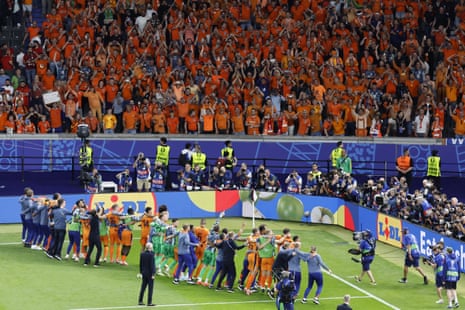 The Netherlands players and fans celebrate their victory over Turkey and making it through to the semi-finals.