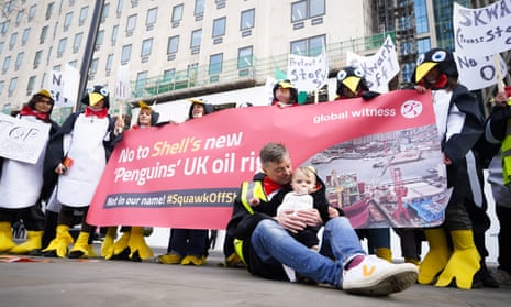 Demonstrators take part in a protest against Shell's new penguin oil rig in the North Sea