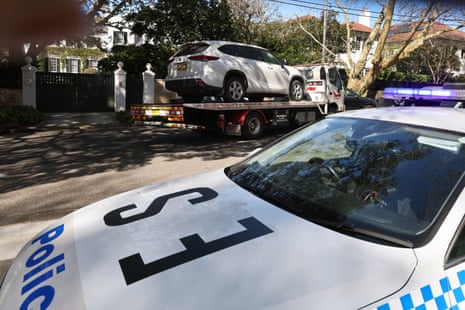 A tow truck removes a car after it was driven into the gates of the Russian consulate in Sydney.